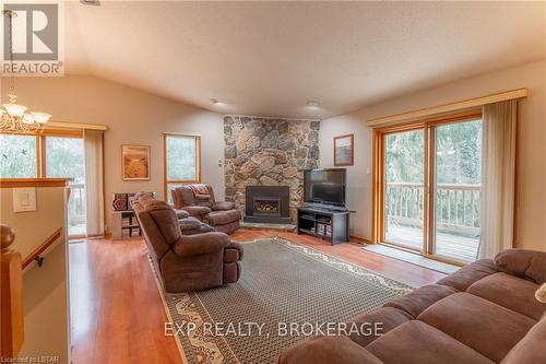 10288 Riverside Drive, Lambton Shores (Grand Bend), ON - Indoor Photo Showing Living Room With Fireplace