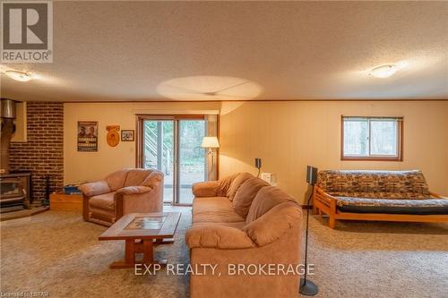 10288 Riverside Drive, Lambton Shores (Grand Bend), ON - Indoor Photo Showing Living Room With Fireplace