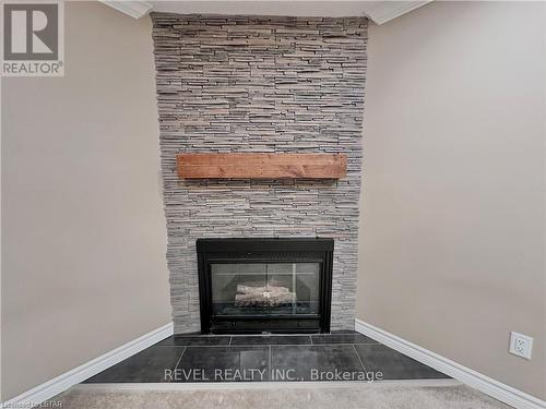 18 - 720 Deveron Crescent, London, ON - Indoor Photo Showing Living Room With Fireplace