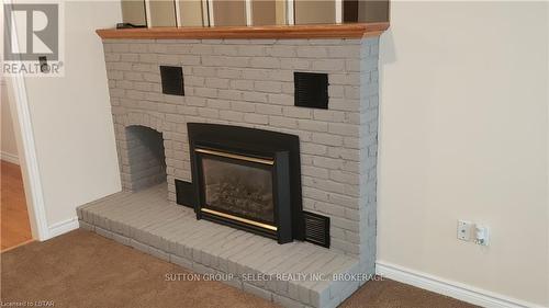 12 Woodside Drive, Tillsonburg, ON - Indoor Photo Showing Living Room With Fireplace