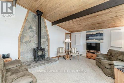 15 Sydney Trail, Huntsville, ON - Indoor Photo Showing Living Room With Fireplace