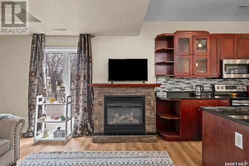 1 211 20Th Street W, Prince Albert, SK - Indoor With Fireplace