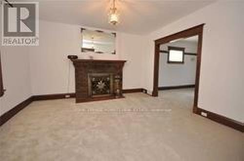 24 Ash Crescent, Toronto, ON - Indoor Photo Showing Other Room With Fireplace