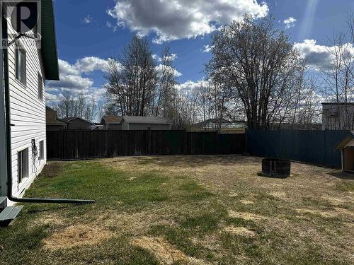 4425 Heritage Crescent, Fort Nelson, BC - Outdoor With Backyard