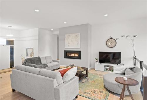 19 Carlington Crescent, Oak Bluff, MB - Indoor Photo Showing Living Room With Fireplace