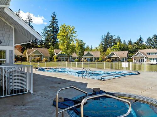 28-5251 Island Hwy West, Qualicum Beach, BC - Outdoor With In Ground Pool