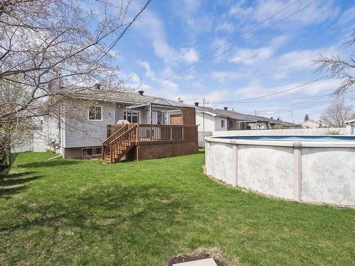Backyard - 6161 Rue Pageau, Laval (Auteuil), QC - Outdoor With Above Ground Pool