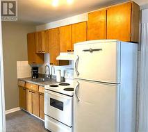 Unit 1 kitchen, solid maple cabinets - 