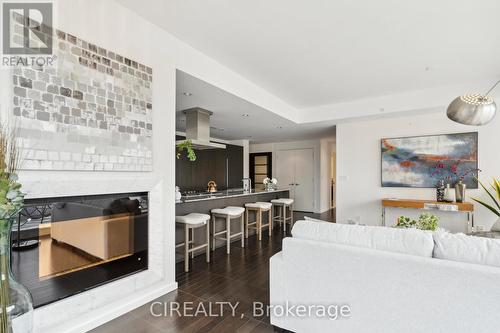 2506 - 180 University Avenue, Toronto, ON - Indoor Photo Showing Living Room With Fireplace