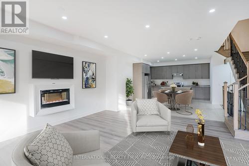 490 Silver Maple Road, Oakville, ON - Indoor Photo Showing Living Room With Fireplace