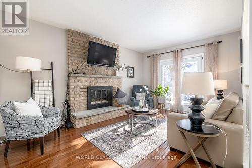 107 Foxhunt Trail, Clarington, ON - Indoor Photo Showing Living Room With Fireplace