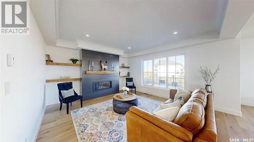 107 Woolf Bend, Saskatoon, SK - Indoor Photo Showing Living Room With Fireplace