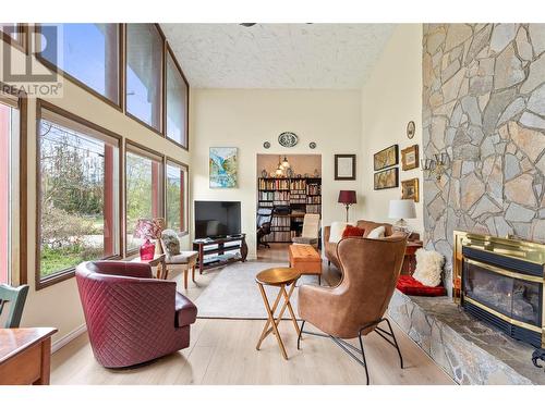 2802 East Vernon Road, Vernon, BC - Indoor Photo Showing Living Room With Fireplace