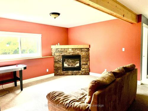 33 Little Cove Rd, Northern Bruce Peninsula, ON - Indoor Photo Showing Living Room With Fireplace