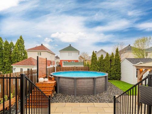 Backyard - 568 Rue Migneault, Longueuil (Le Vieux-Longueuil), QC - Outdoor With Above Ground Pool