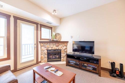 310 - 1500 Mcdonald Avenue, Fernie, BC - Indoor Photo Showing Living Room With Fireplace