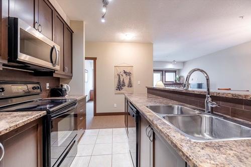 310 - 1500 Mcdonald Avenue, Fernie, BC - Indoor Photo Showing Kitchen With Double Sink