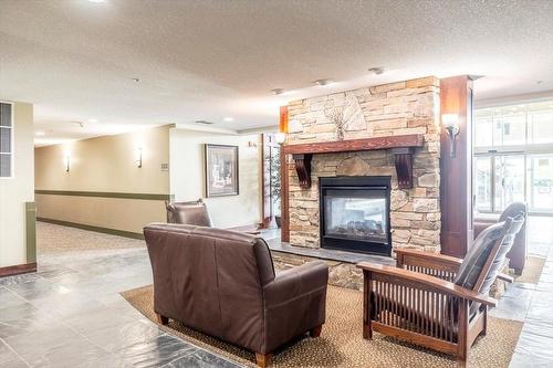 310 - 1500 Mcdonald Avenue, Fernie, BC - Indoor Photo Showing Living Room With Fireplace