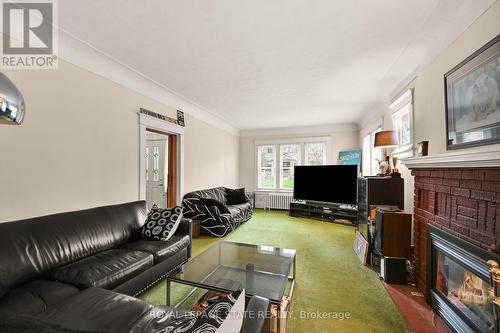91 Delaware Avenue, Hamilton, ON - Indoor Photo Showing Living Room With Fireplace
