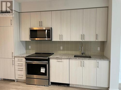 1414 - 4055 Parkside Village Drive, Mississauga, ON - Indoor Photo Showing Kitchen With Upgraded Kitchen
