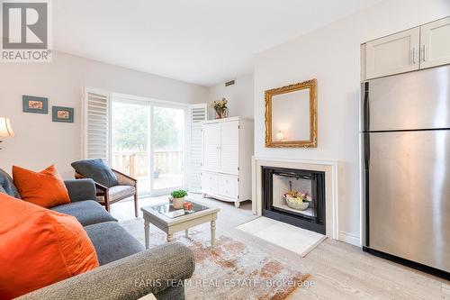 16 - 60 Laguna Parkway, Ramara, ON - Indoor Photo Showing Living Room With Fireplace
