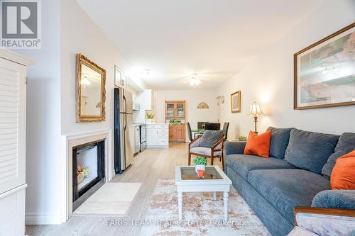 16 - 60 Laguna Parkway, Ramara, ON - Indoor Photo Showing Living Room With Fireplace