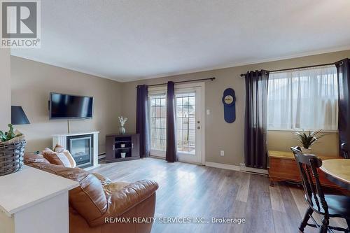 9 Greenhills Square, Brampton, ON - Indoor Photo Showing Living Room With Fireplace