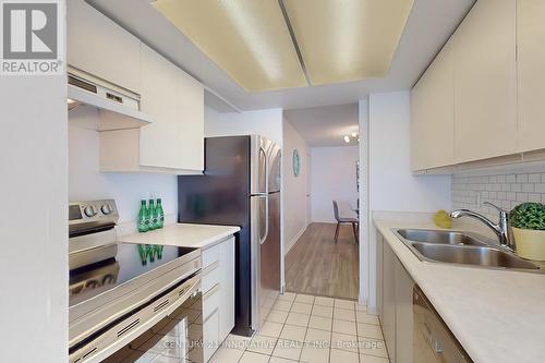 311 - 11753 Sheppard Avenue E, Toronto, ON - Indoor Photo Showing Kitchen With Double Sink