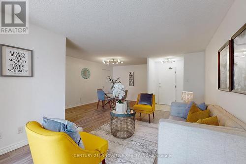 311 - 11753 Sheppard Avenue E, Toronto, ON - Indoor Photo Showing Living Room