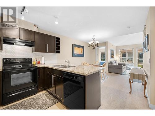 1089 Sunset Drive Unit# 407, Kelowna, BC - Indoor Photo Showing Kitchen With Double Sink