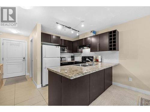 1089 Sunset Drive Unit# 407, Kelowna, BC - Indoor Photo Showing Kitchen With Double Sink