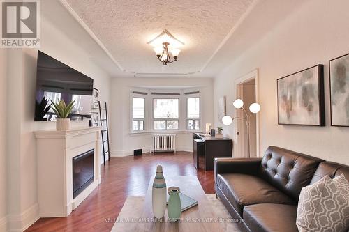 24 Coolmine Road, Toronto, ON - Indoor Photo Showing Living Room With Fireplace