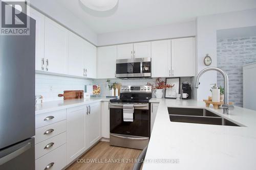 713 - 1600 Charles Street, Whitby, ON - Indoor Photo Showing Kitchen With Double Sink
