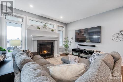 734 Meadowridge Circle, Ottawa, ON - Indoor Photo Showing Living Room With Fireplace