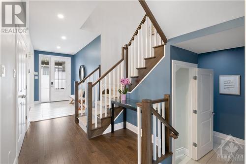 Stairs leading to 2nd floor, with basement access door, mudroom, half bath on the right. - 109 Spindrift Circle, Manotick, ON - Indoor Photo Showing Other Room