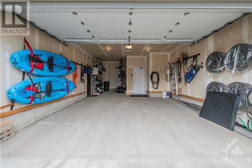 Large tandem garage with space for multiple vehicles. - 109 Spindrift Circle, Manotick, ON - Indoor Photo Showing Garage