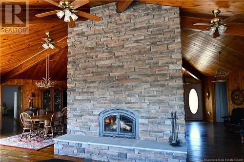 388 Fundy Drive, Wilsons Beach, NB - Indoor Photo Showing Living Room With Fireplace