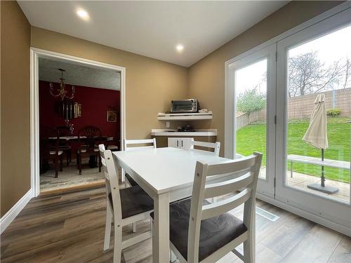 Kitchen - view of eat in area and backyard - 407 Melanie Crescent, Ancaster, ON - Indoor Photo Showing Dining Room