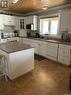 Green Acres Acreage, Turtle Lake, SK  - Indoor Photo Showing Kitchen With Double Sink 