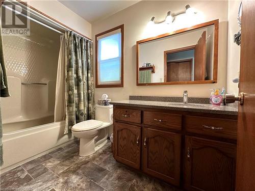*taken with a wide lens to show entire space* - 7525 Wellington Road 8, Mapleton, ON - Indoor Photo Showing Bathroom