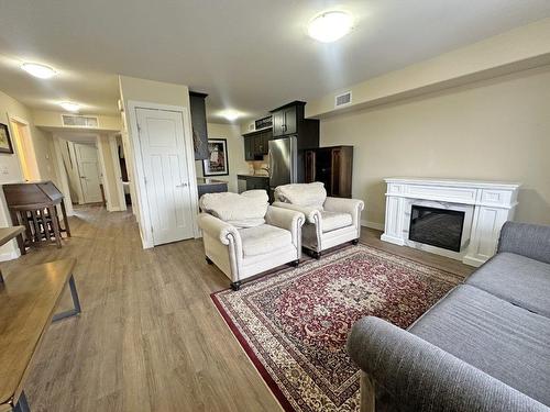 3 695 Weiler Boulevard, Thunder Bay, ON - Indoor Photo Showing Living Room With Fireplace