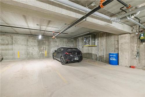 109 1505 Molson Street, Winnipeg, MB - Indoor Photo Showing Garage