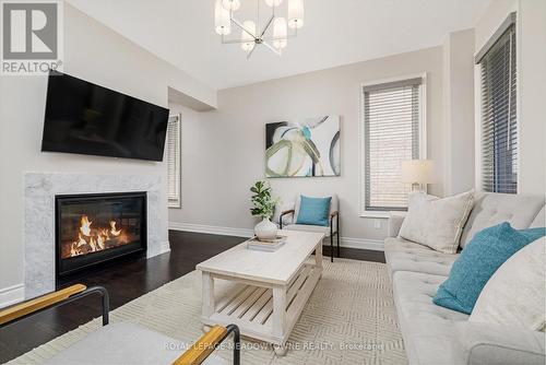 27 Gruenwald Gate, Brampton, ON - Indoor Photo Showing Living Room With Fireplace