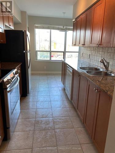 204 - 38 Fontenay Court, Toronto (Edenbridge-Humber Valley), ON - Indoor Photo Showing Kitchen With Double Sink