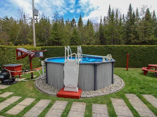 Pool - 32 Ch. Éloi, Bury, QC - Outdoor With Above Ground Pool With Backyard