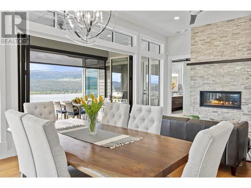 8856 Somerset Place, Vernon, BC - Indoor Photo Showing Dining Room With Fireplace