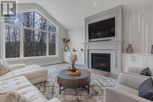 7 Walter James Parkway, Springwater, ON - Indoor Photo Showing Living Room With Fireplace
