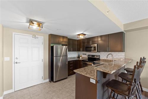 45 Kingsbury Square|Unit #402, Guelph, ON - Indoor Photo Showing Kitchen With Stainless Steel Kitchen