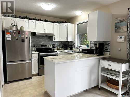 11226 Gardiner Drive, North Battleford, SK - Indoor Photo Showing Kitchen With Stainless Steel Kitchen With Double Sink