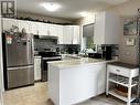 11226 Gardiner Drive, North Battleford, SK  - Indoor Photo Showing Kitchen With Stainless Steel Kitchen With Double Sink 